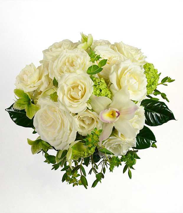 White rose bouquet with a pale orchid and green accents