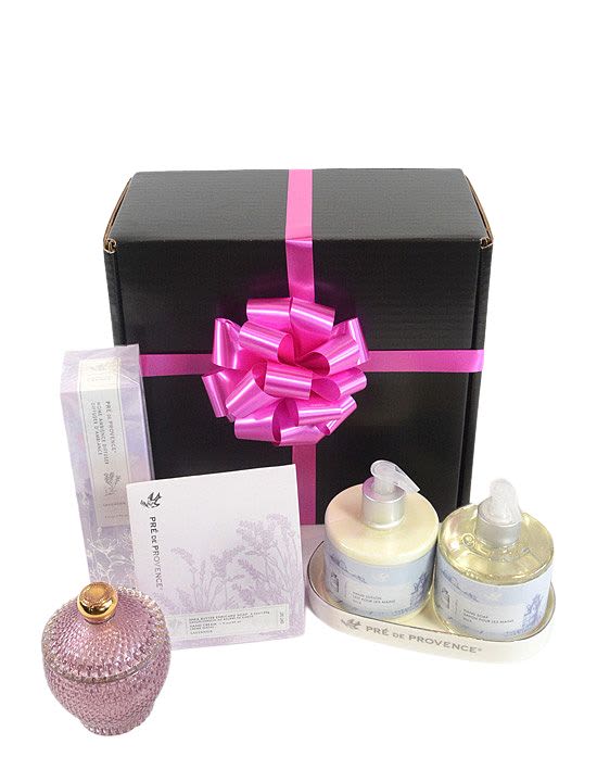 Gift box with pink ribbon and assorted bath products