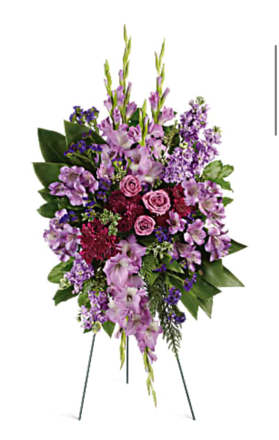 Standing floral spray with pink roses and purple flowers