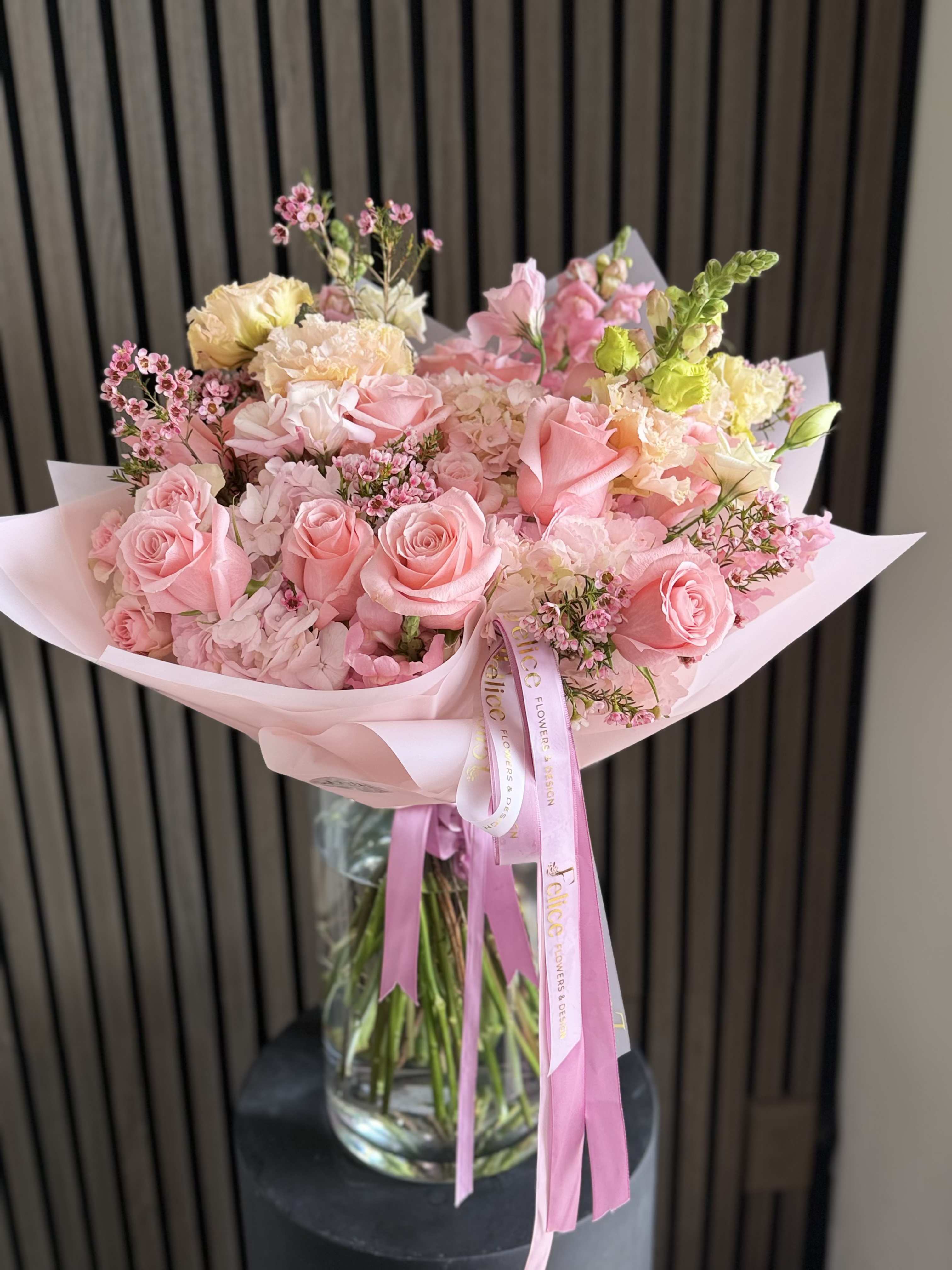 Soft Pink Elegance Bouquet - A soft and elegant bouquet featuring a delicate blend of blush pink roses, seasonal blooms, and textured accents. Designed in a light, airy garden style, this arrangement highlights gentle pink tones that create a romantic and graceful look. Perfectly balanced and beautifully wrapped with signature Felice Flowers &amp; Design ribbon, this bouquet brings a sense of charm and sophistication. Ideal for Birthday, Thank You, Get Well, Baby Shower, or Just Because. Please note: flower varieties may vary due to seasonality while maintaining the same color palette and overall style.
