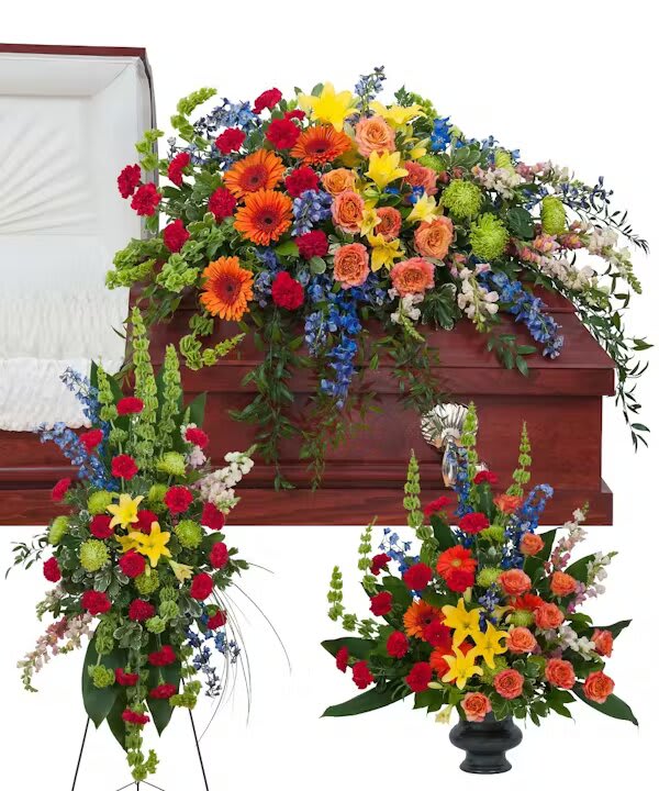 TREASURED CELEBRATION TRIO - The treasured celebration trio includes a casket spray, standing easel spray and crescent urn arrangement.  