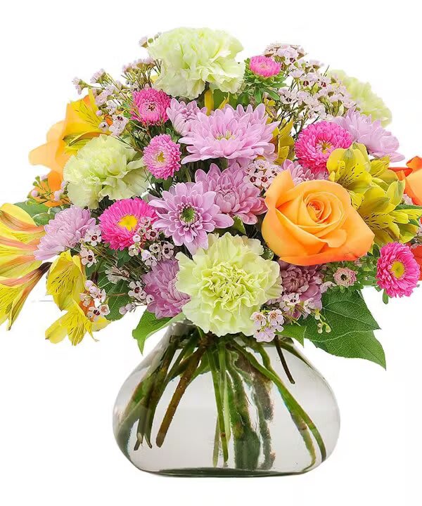 SPRING BREEZE - Capture the freshness of spring. Spring Breeze uses a mix of pastel flowers in a rosie posie vase will breath life into any space.  