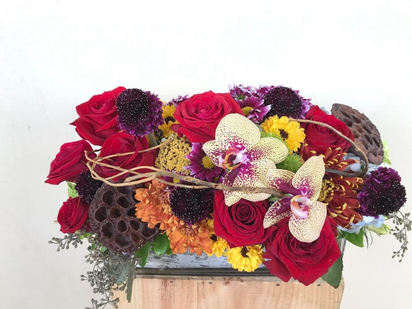 Fall Symphony  - Roses , Orchids ,Lotus seeds other in 10" glass container ,7"- 8" tall