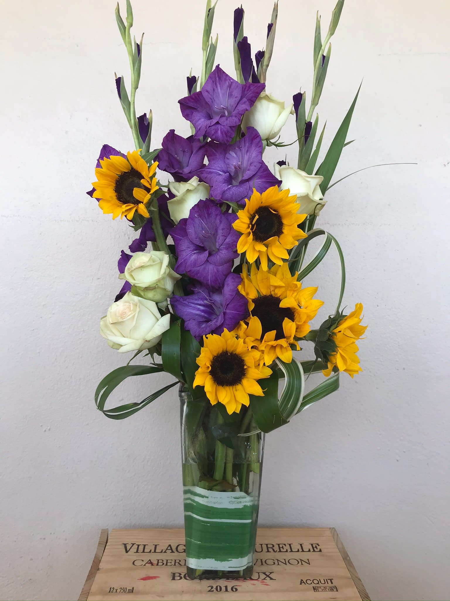 Happy one  - Gladiolus flowers , Roses, Sunflowers in glass vase 