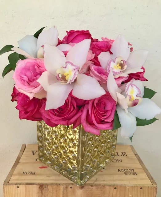 Ruby Roses - Roses ,Orchid blooms in 6x6” glass vase 