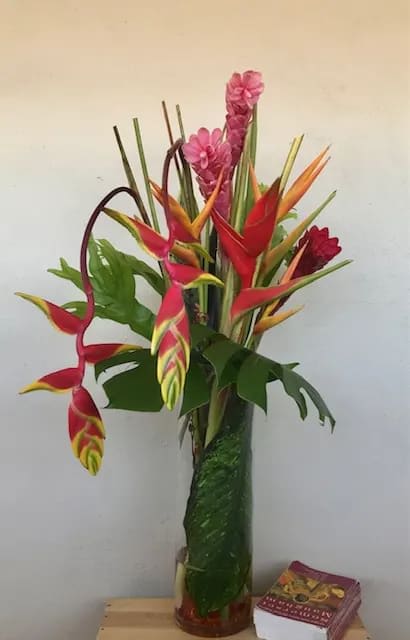 Tropical Wind - Tropical flowers in tall glass vase