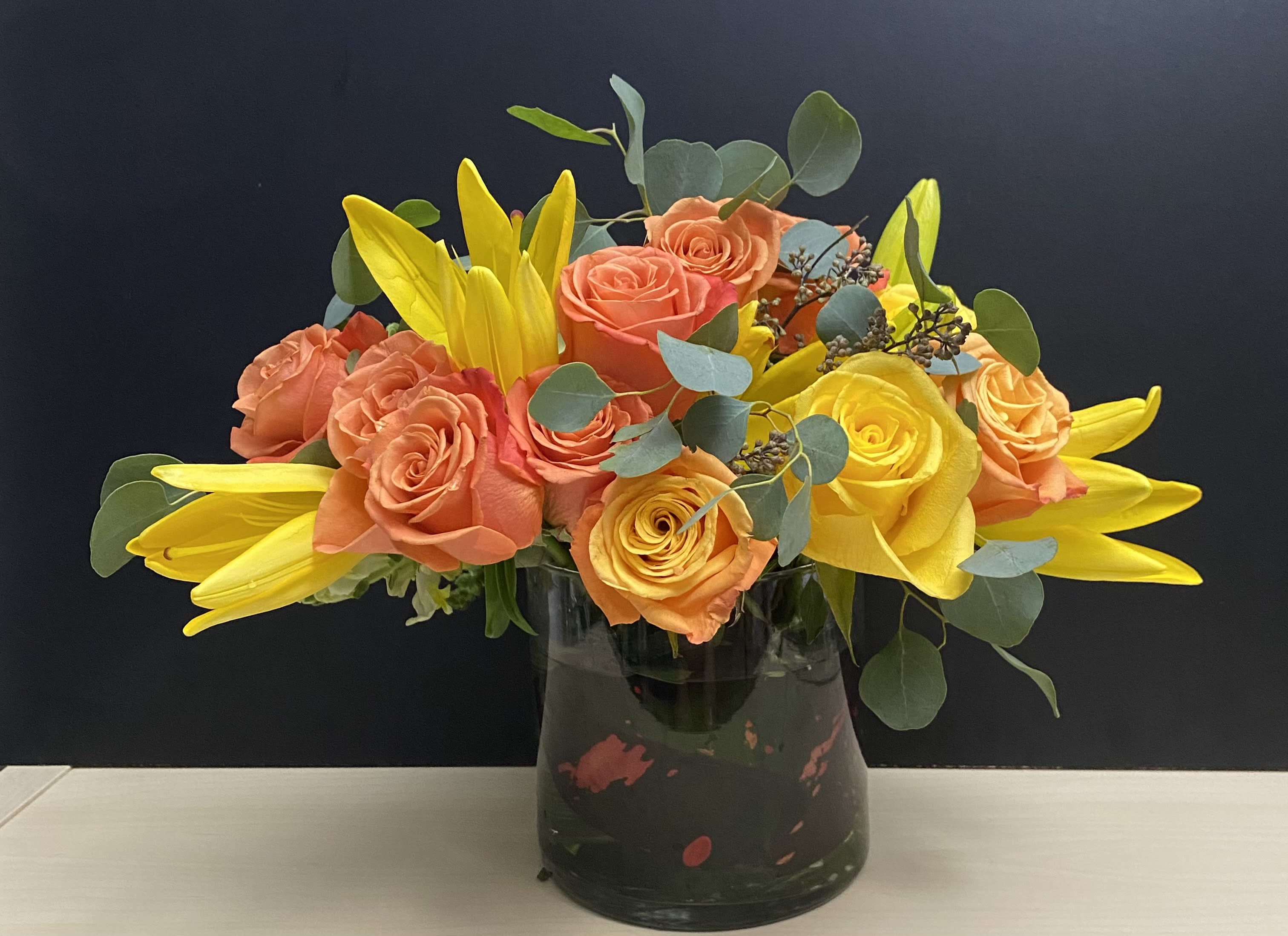 Sunshine Whispers  - Roses, Lilies, green in 6x6 glass vase 