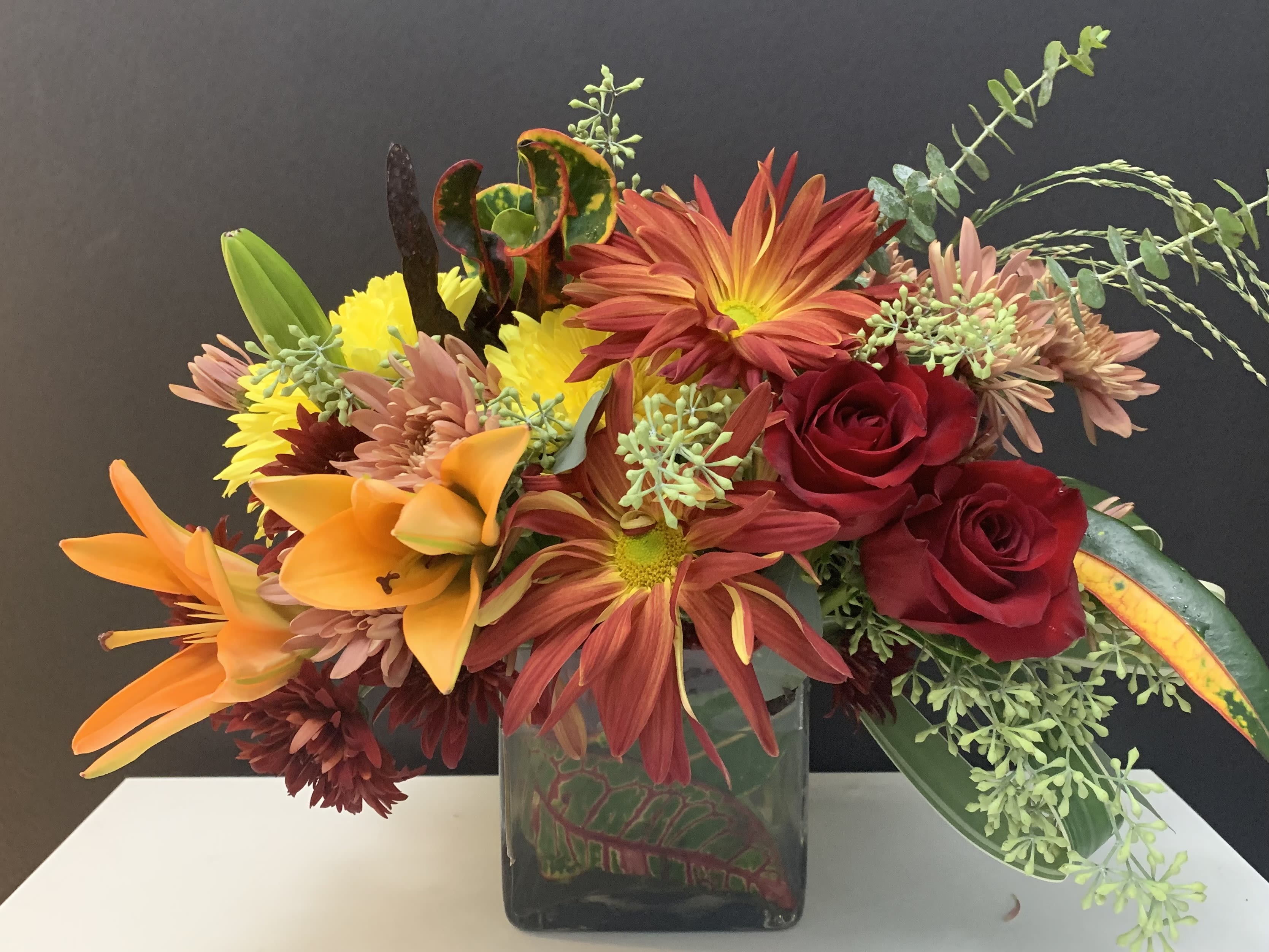 Colors Exchange  - Mums, Lilies, Eucalyptus in square glass vase 