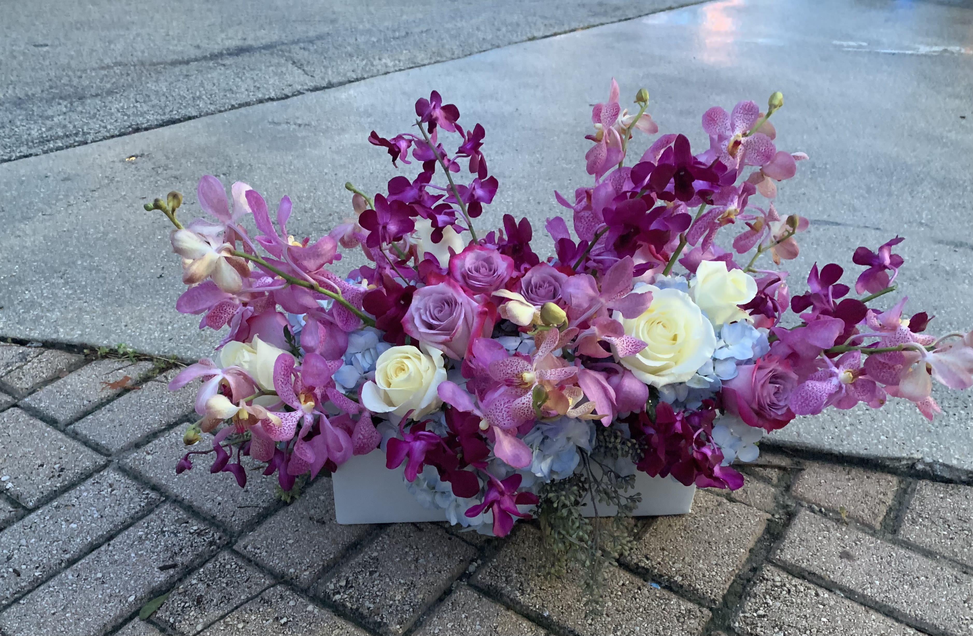 Flowers for Yachts 2 - Orchid blooms, Hydrangeas, Roses inn ceramic container 
