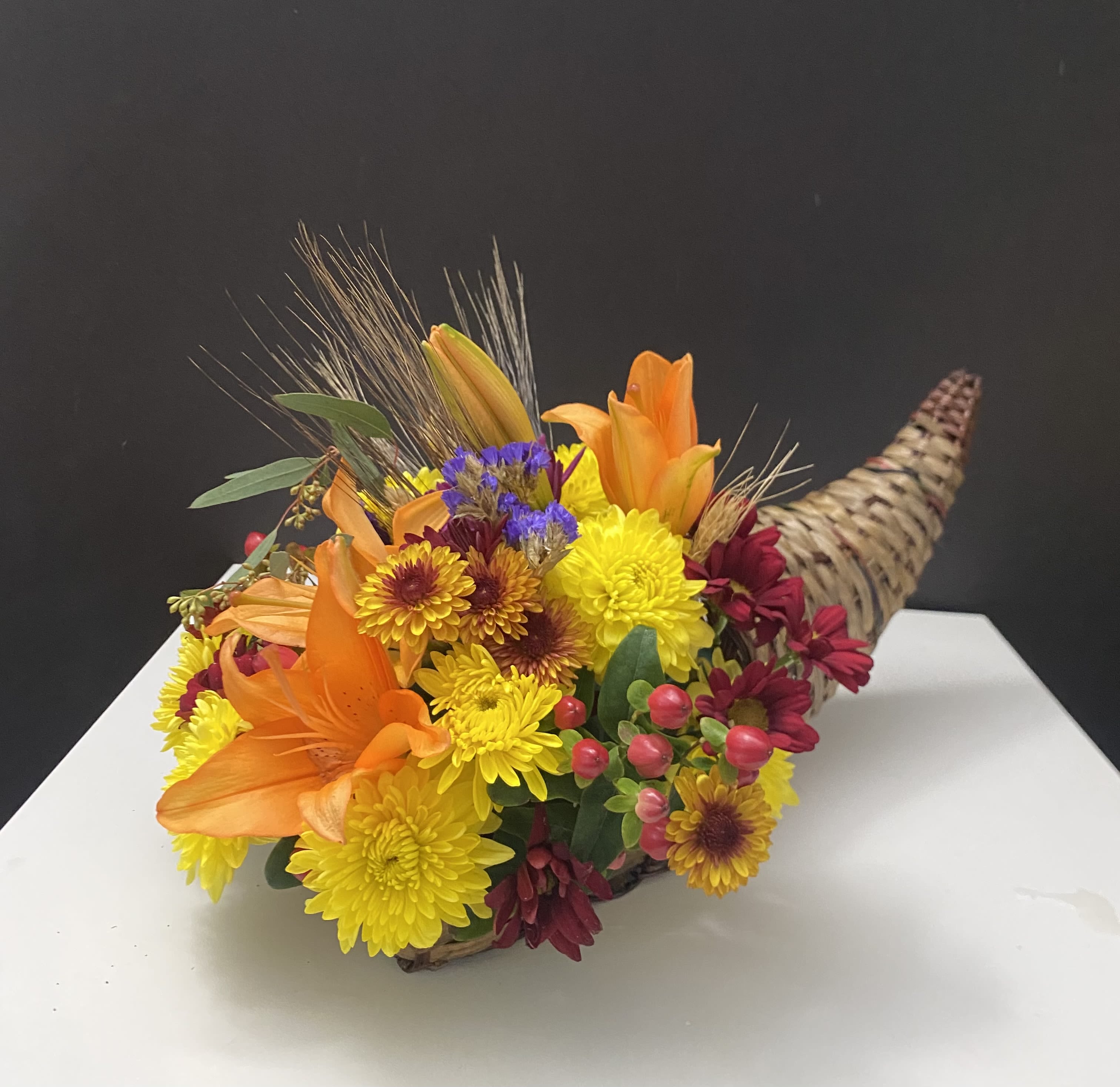 Thanksgiving’s Arrangement  - Fall flowers in curnucopia