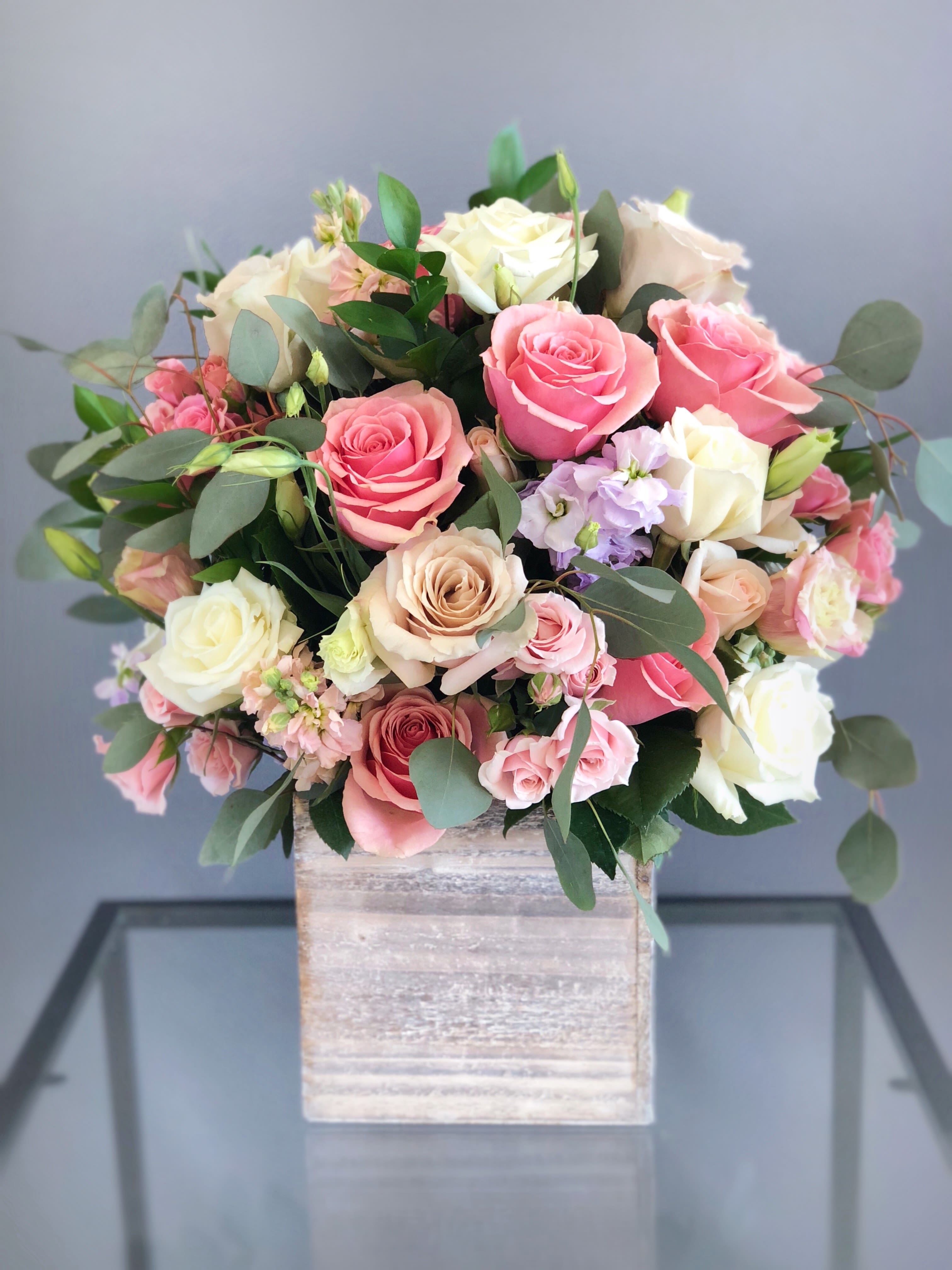 #14 - Tall wood box arrangement Pink &amp; White - If You want bouquet with a twist, choose our flower boxes. We have wood boxes for rustic looking arrangements, or hat boxes for a more elegant look. It’s a beautiful and convenient way. Flowers in boxes don’t need vases. That makes it perfect for transportation and keeping flowers hydrated and secure.