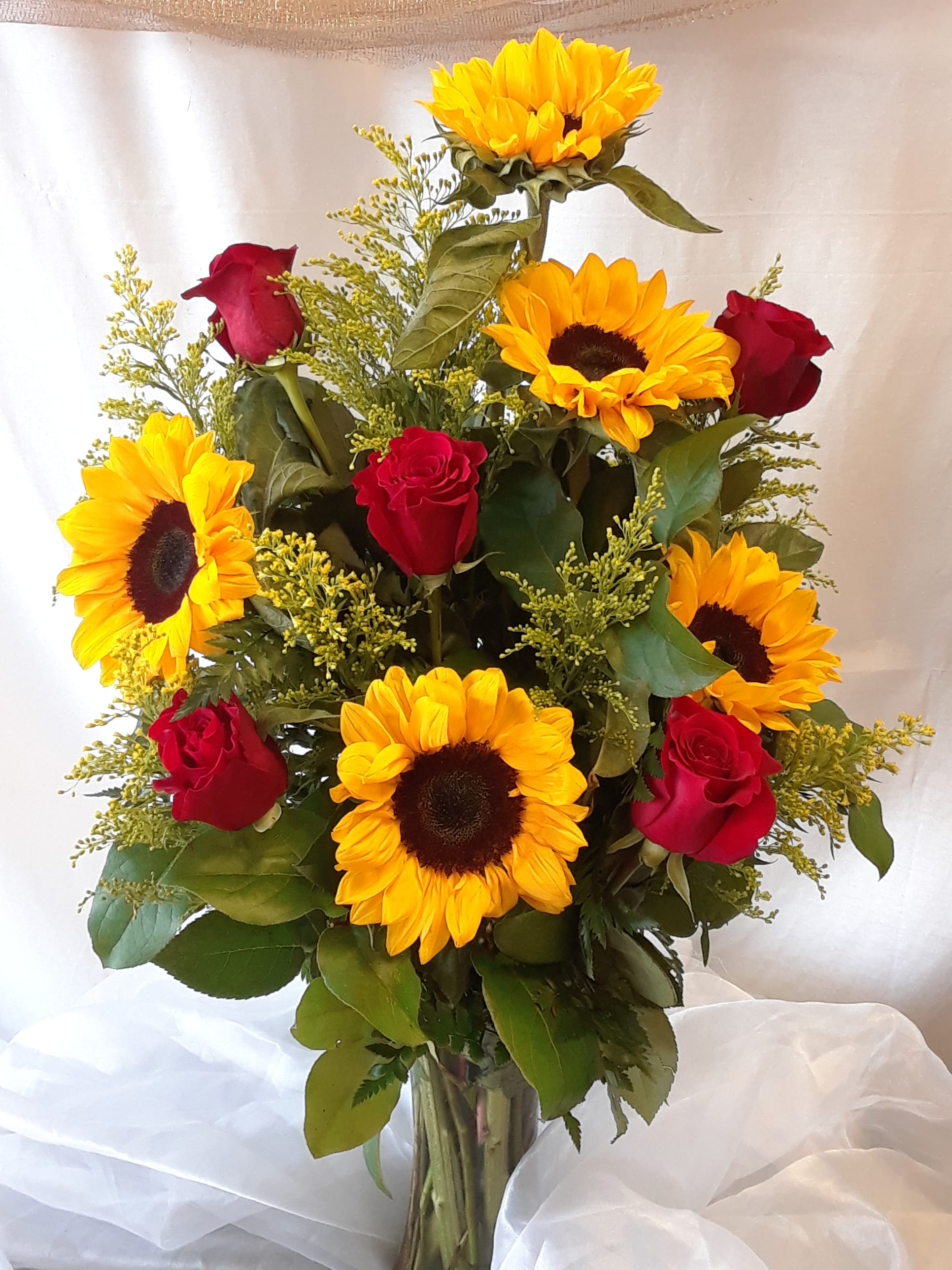 #35 - Divine Sunflowers &amp; Roses - This beautiful arrangement of roses, sunflowers surrounded by solidago and greens is sure to brighten the recipients day. 