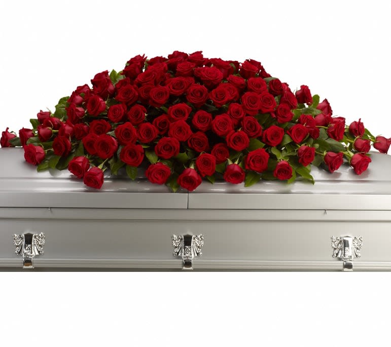 Greatest Love Casket Spray - A loving embrace of rich, regal roses in an all-red spray to adorn the casket. A full spray of crimson roses, alternating large with slightly smaller. Approximately 62" W x 22" H