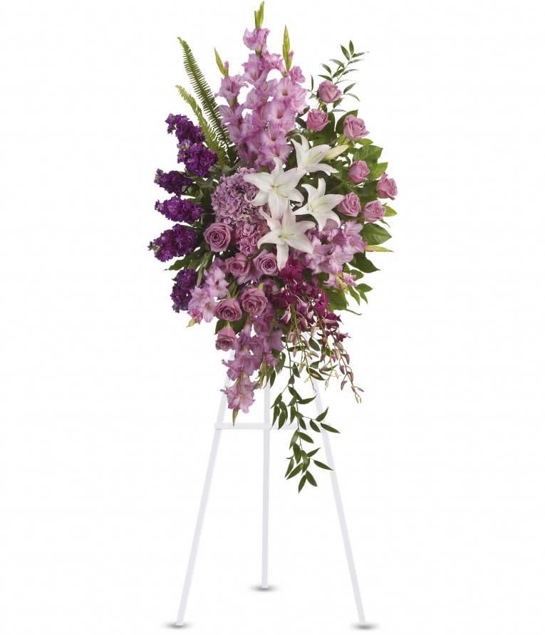 Sacred Garden Spray - A lovely lavender spray of flowers lets you share your compassion, hope and beauty with all. Beautifully simple. Beautifully serene. It's the perfect way to send your sincere sympathy. Lavender, purple and white flowers like hydrangea, orchids, roses, oriental lilies and more create a beautiful spray. A wonderful tribute. Approximately 26" W x 51" H