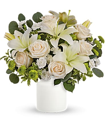 Teleflora's Eternally Elegant Bouquet - This ethereal arrangement is a calming, peaceful gesture that shows them you care. Elegant white blooms accompany a timeless matte white vase. Roses, white lilies and carnations are accented with leaves of fragrant and calming eucalyptus in a timeless matte white vase. Orientation: All-Around