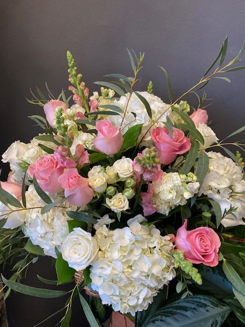 Pink and white rose bouquet with hydrangeas and greenery