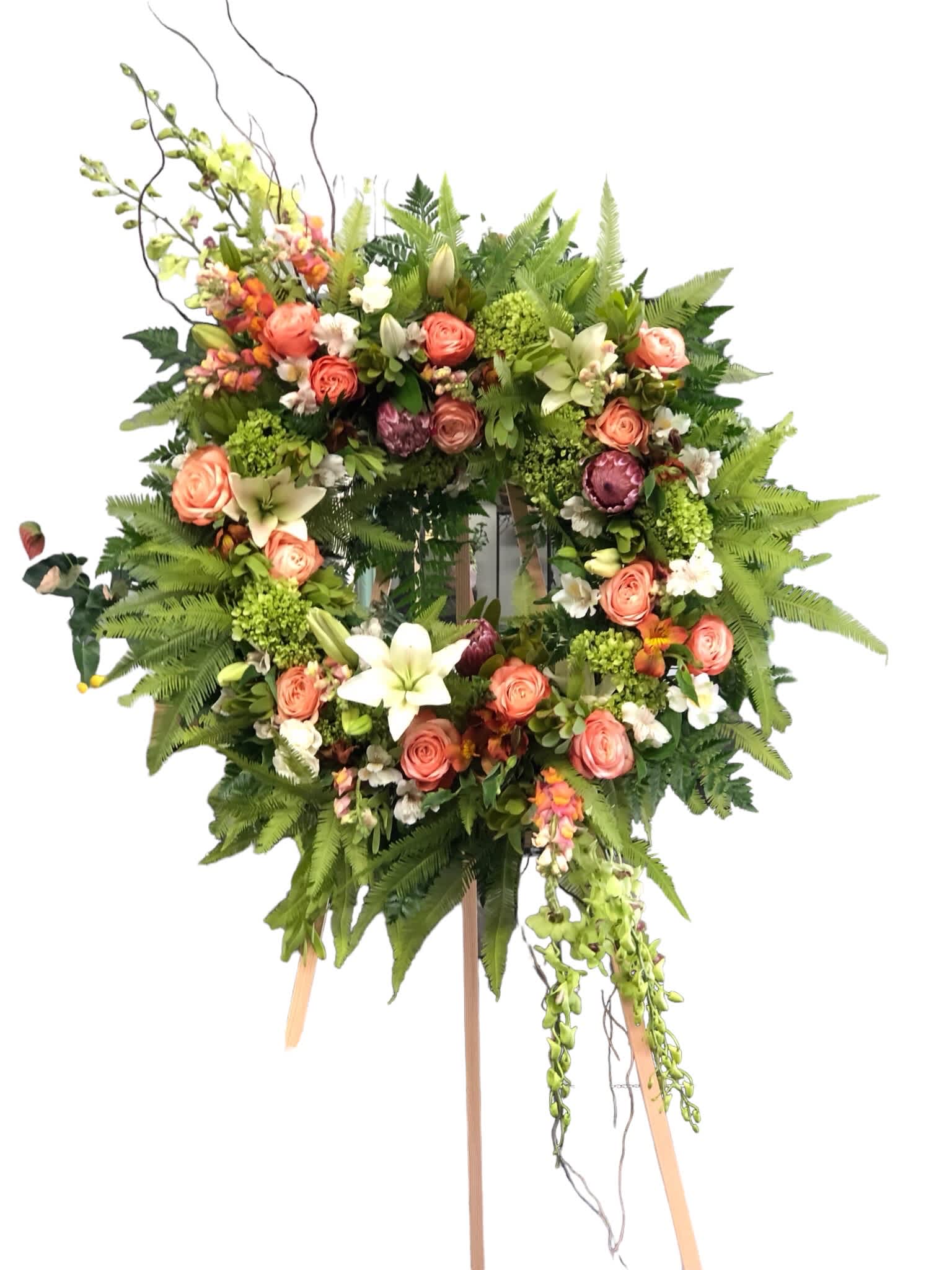 Sympathetic Beauty - Mix of orange roses, orchids, protea, alstromeria, snapdragon and tropical leaves