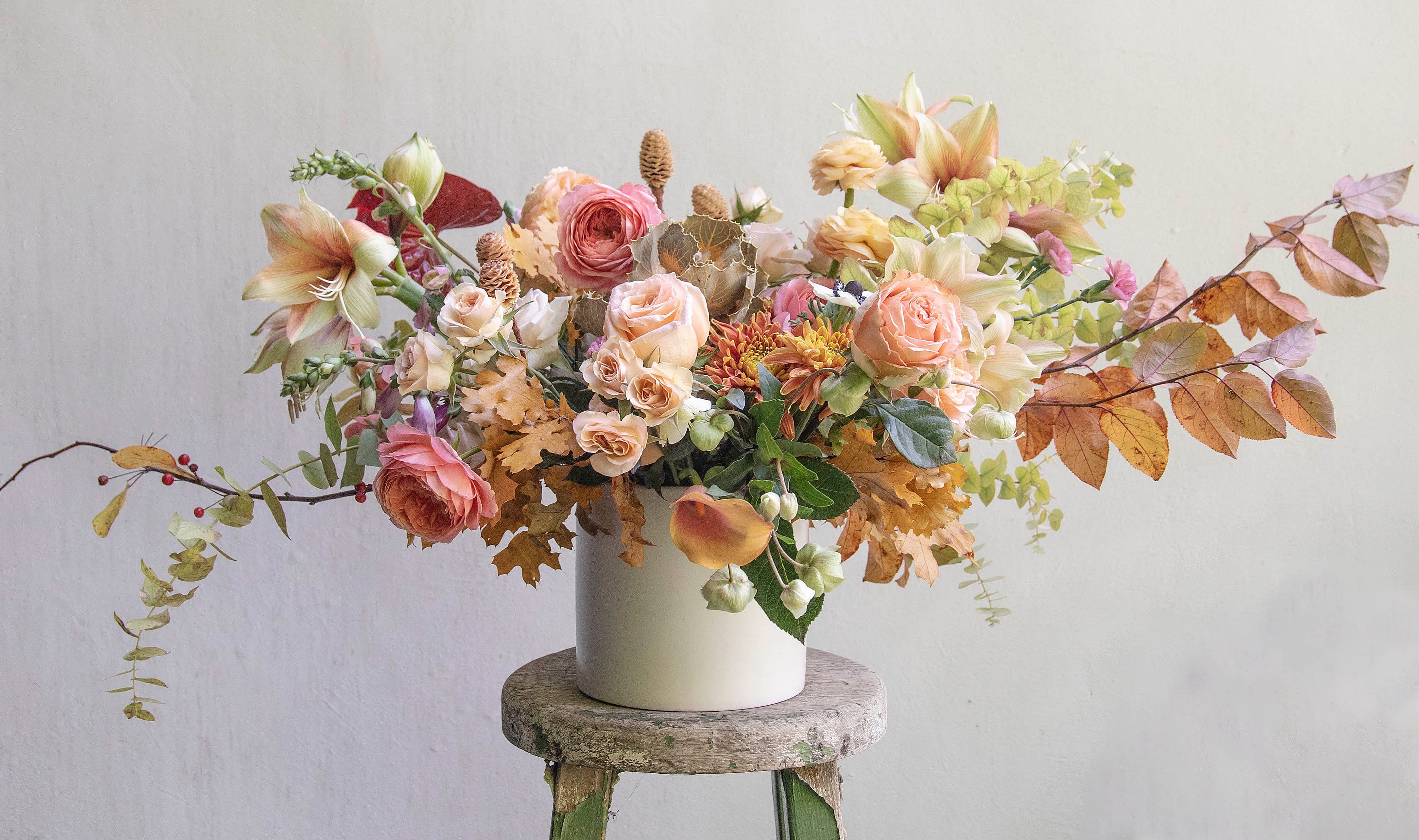 The Holiday Stretch Arrangement. - Branching out with the colors and Petals of the Season.  This Gentleman makes quite a statement, and is especially suited for your Holiday tables, mantles and such.  Wow your guests with this stunner while making quite the impression too boot!  Soft Browns, Pale Peaches, Mustards, Dusty Pinks, Coral Charm, Sage Greens....Yes!