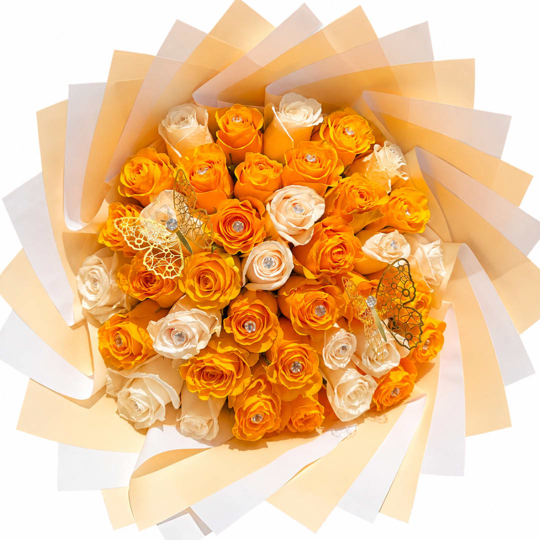 Bouquet of orange and cream roses wrapped in layered paper