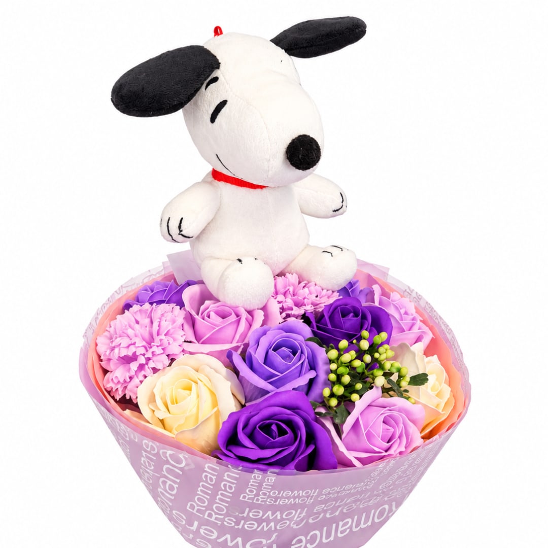 Snoopy plush sitting on a bouquet of pastel roses and carnations