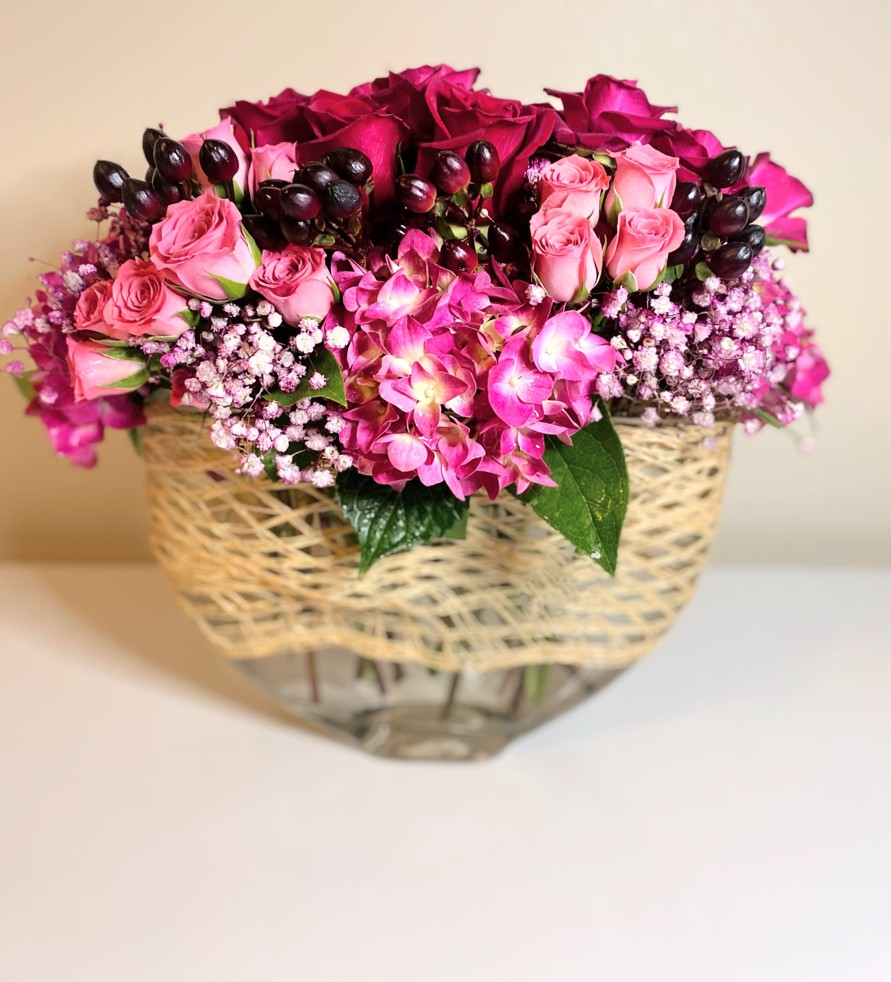 Heart Throb - The heart throb is a lush stylized floral arrangement with mixture of roses and other seasonal flowers. Rich deep colors that will spice up any anniversary or Birthday.