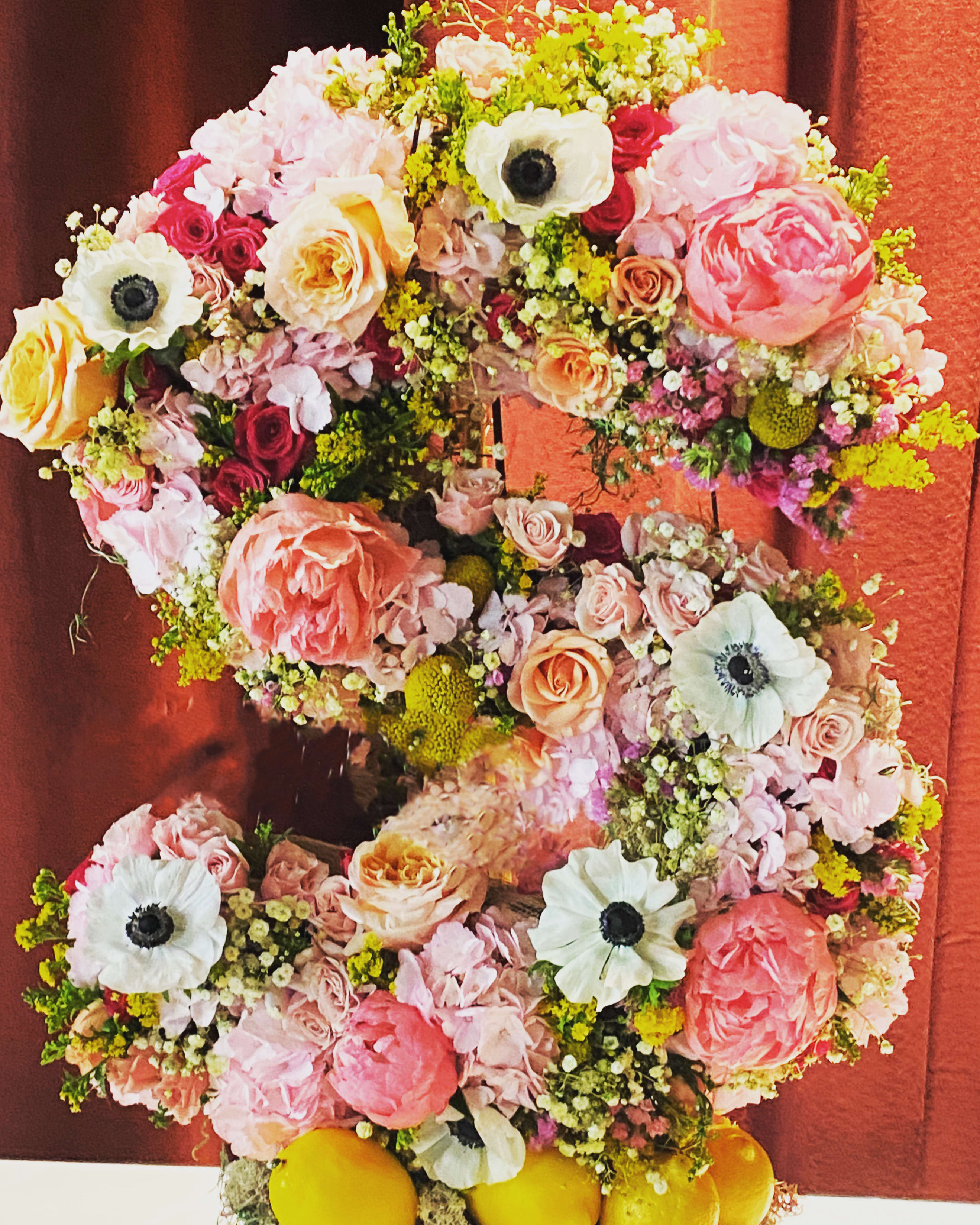 The Letter - A gorgeous flowered Letter for your special event or custom funeral piece. This one is 32 in high and 15 inches wide. Size may vary depending on the letter. Please add the preferred Letter, and color palette as a request in your order and desired floral. You can also call after you’ve placed your order to confirm your description and will definitely Reach out to you. Easle comes in various sizes. You can choose a low floor easel or 54 in. For events we can build a desired standing foundation. An all around Letter will be an extra $75 for floral. 
