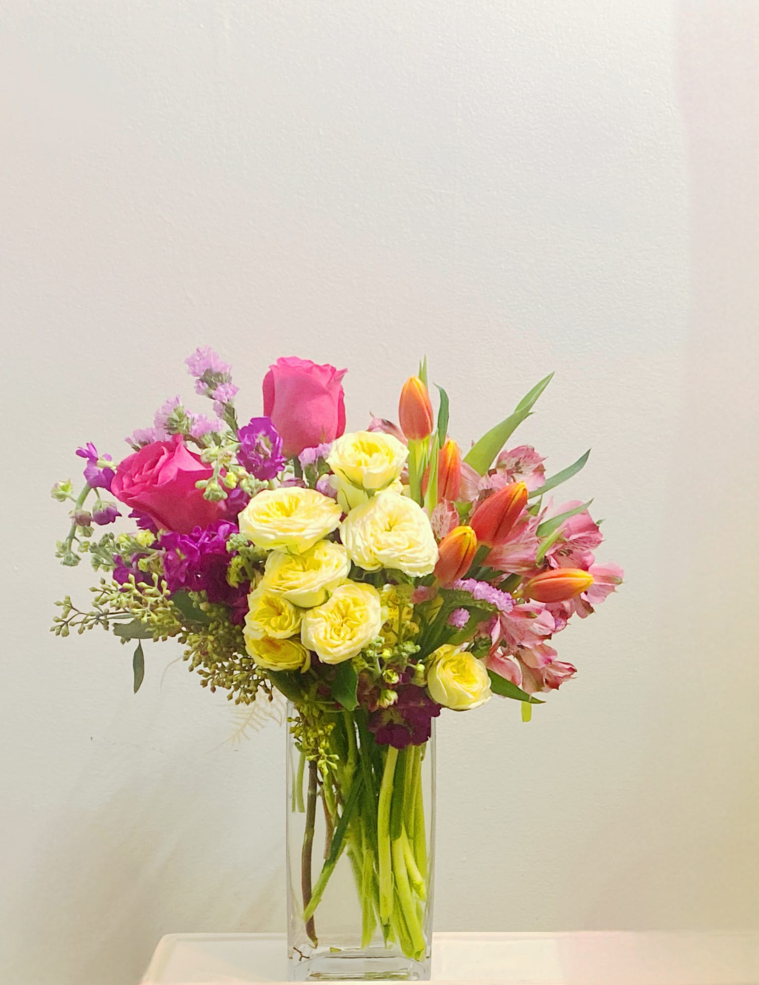 Smile bouquet -  Smile bouquet is a stylized clean and modern ensemble with roses and tulips paired with other seasonal flowers. 