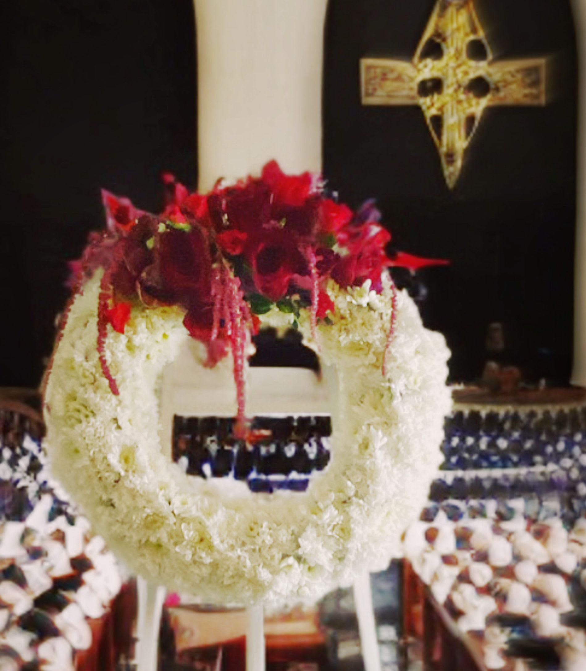 Farewell wreath on stand - Beautifully regal crisp white floral accented with striking red blooms ;orchids and roses on a white wooden easel.  Attn: you can prebook this in any colors; please add any special request to the instructions. 