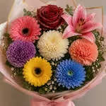 Bling Mixed Flowers Vase Package - A lively burst of color, this mixed flower arrangement in a vase, is a cheerful pick for a birthday bouquet, everyday gifting, or to brighten someone's day, creating a playful yet slightly romantic look that tells the recipient they're celebrated and thought of. Flowers may vary depending on availability and season.  The arrangement is wrapped and tied with a ribbon for a neat, gift-ready presentation; small filler accents add texture and make the colors pop.   Perfect for friends, coworkers, or anyone who loves bold color, this bouquet reads as joyful and sincere-the kind of gift that makes someone feel truly seen. Care is simple: keep the stems in fresh water, trim ends every few days, and display away from direct heat to extend vase life.