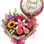 Thank You Mixed Flower Vase Package - A bold and cheerful thank-you balloon makes this thank-you mixed flower vase package a joyful choice for appreciation gifts and everyday gratitude. Perfect as a thank-you bouquet for a teacher, coworker, neighbor, or anyone who brightened your day, it reads as warm and celebratory the moment the recipient sees it-bright colors, lively textures, and an uplifting message all in one.  The stems arrive wrapped and tied with ribbon and a round "thank-you" balloon for an extra touch of delight. The overall presentation is gift-ready and easy to display in a vase. Flowers may vary depending on availability and season.  Send this when you want the person you're thanking to feel truly seen and appreciated-a thoughtful way to mark help, hospitality, or a kindness both big and small. Arrangement sizing and vase placement are ready for immediate display; for best longevity, trim stems and refresh water every two days.