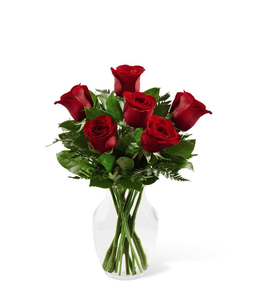 Bouquet of red roses in a clear glass vase