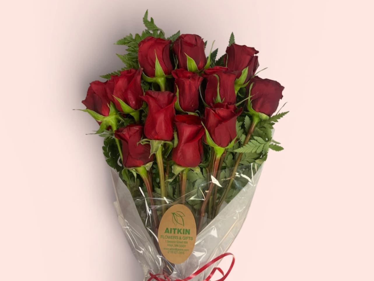 Bouquet of red roses wrapped in clear plastic