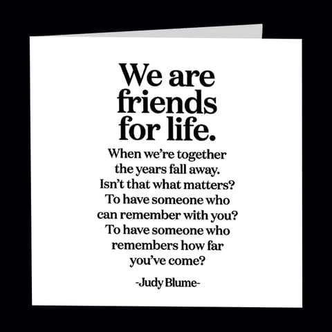White quote card with black text about friendship