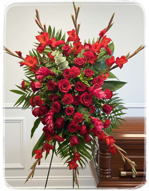 Tall red floral standing spray with roses and lilies