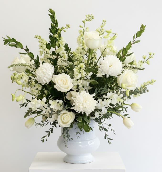 White floral arrangement in a white vase