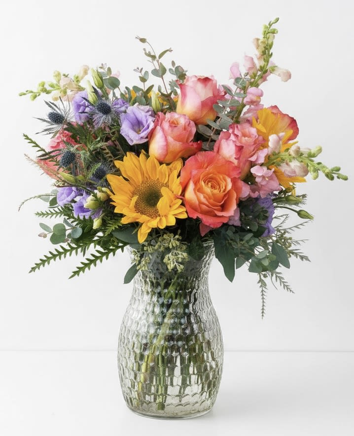 Wild and Free - This multicolored arrangement has sunflowers, roses, lizzy and snapdragon.