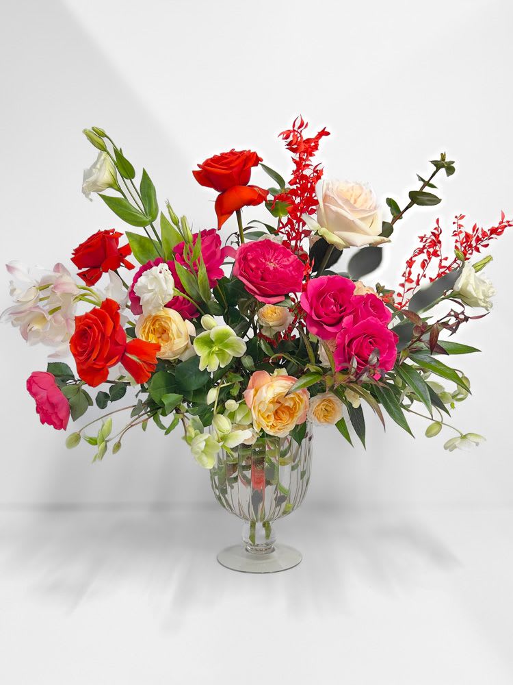 Colorful rose arrangement in a clear glass vase