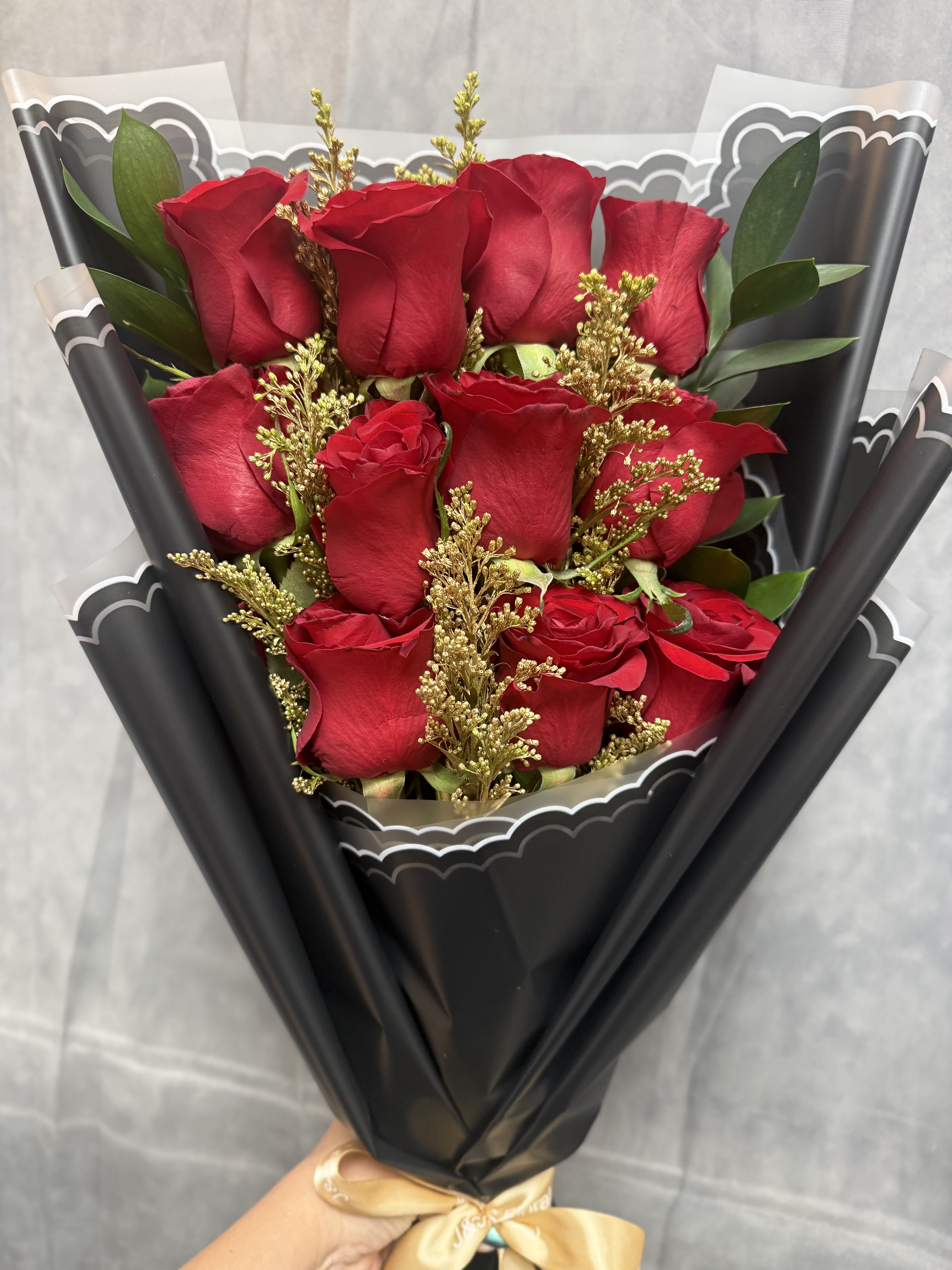 Golden Red Roses layered Bouquet  - We’re so excited to share this exclusive look at how we create our stunning Golden Red Roses Layered Bouquet! From carefully selecting the freshest roses to expertly wrapping them in our luxurious Chanel-inspired wrapping papers, every detail is crafted with elegance and care.  Available in 1 Dozen, 2 Dozen, or 3 Dozens, this bouquet is perfect for making a bold statement for any occasion.