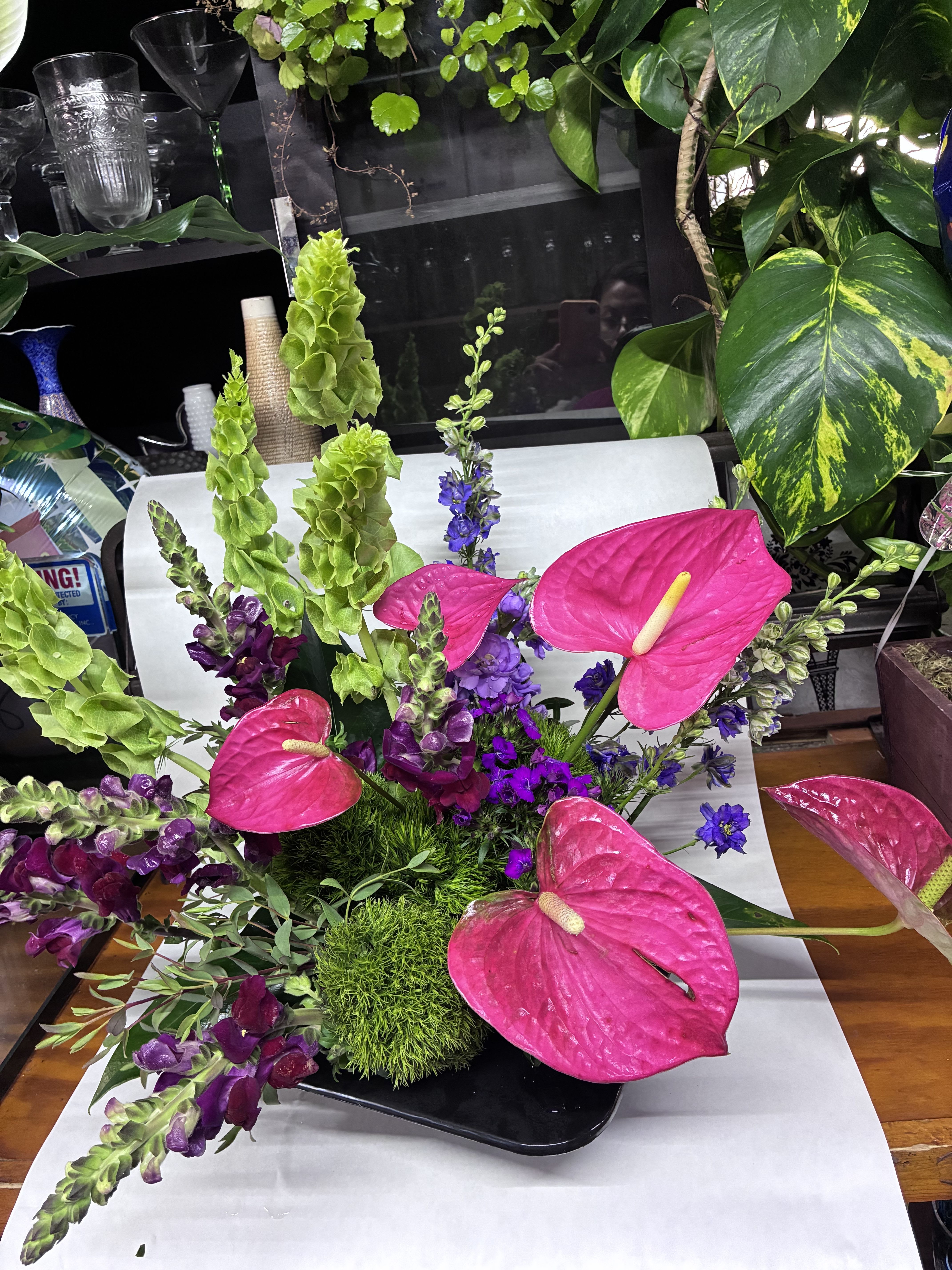 Island Breeze Bouquet - Bouquet delivered approximately as pictured with tropical blooms and lush greenery in a classic arrangement.