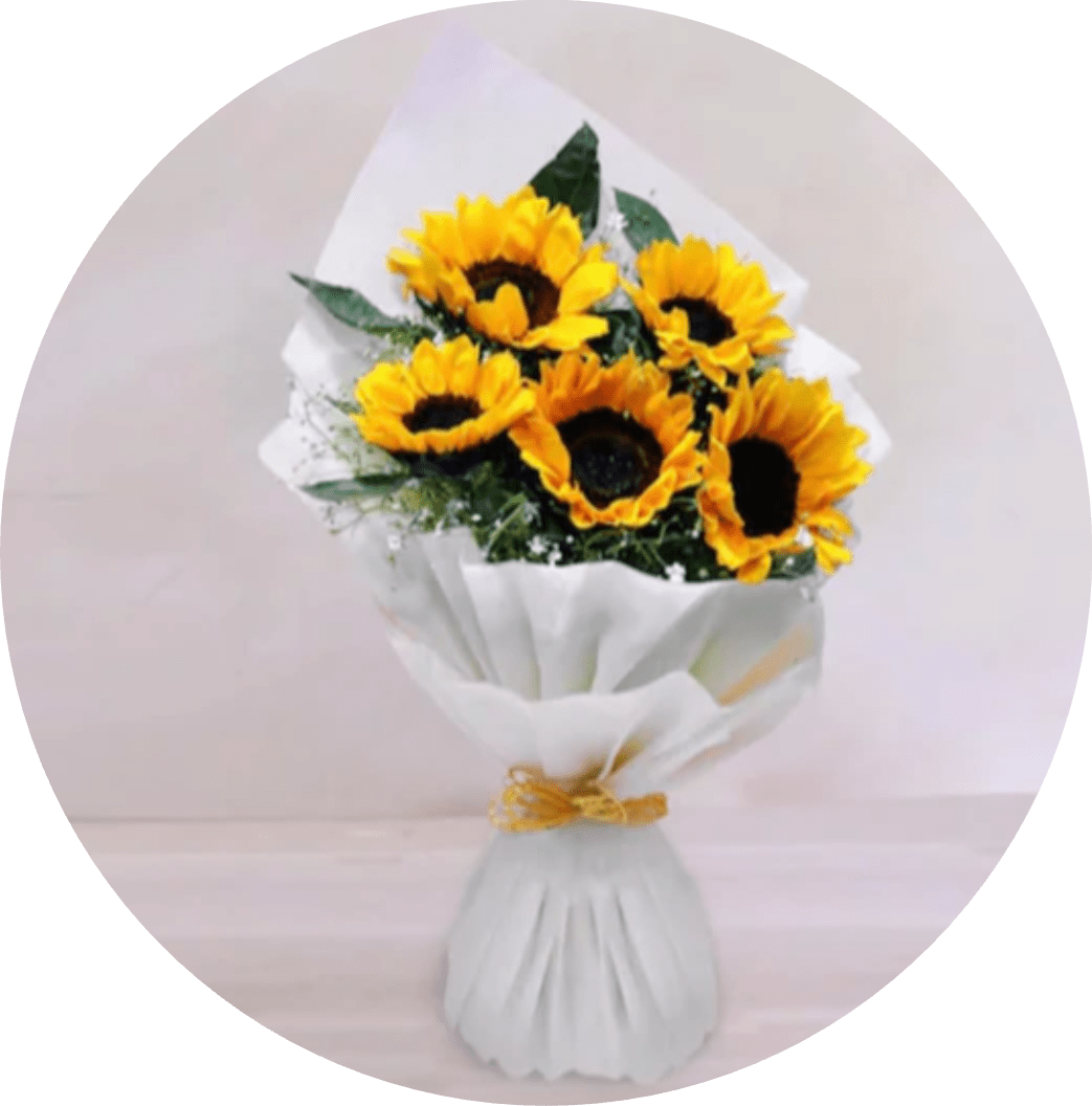 Lovely Sunshine - Bold clusters of bright yellow sunflowers make an immediate sunny statement-this sunflower bouquet is perfect for a birthday, thank-you, congratulations, or a just-because pick-me-up. The dark centers create a striking contrast against the vivid petals so the recipient will feel noticed and uplifted the moment they see it.  Five cheerful sunflowers are gathered in a tight, hand-tied style, wrapped in crisp white paper and finished with a small gold ribbon for a modern, gift-ready look. A white vase-like base peeks beneath the wrap in some presentations, offering a clean silhouette that keeps the focus on the blooms. This casual, fresh arrangement ships as an easy, everyday gift that requires minimal care-keep stems in fresh water and away from direct heat to preserve their sunny presence.