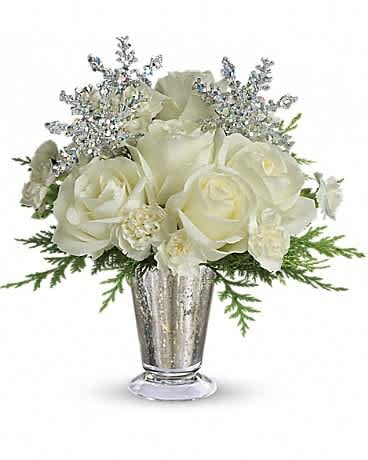 Teleflora's Winter Glow - Sparkling and splendid, this elegant arrangement is perfect for any winter celebration. It makes a spectacular centerpiece, amazing room accent, even an inspired anniversary gift. Especially if it's a silver anniversary! Gorgeous white roses, asiatic lilies and miniature carnations are beautifully arranged with magical silver snowflakes and delivered in a glamorous silver Mercury Glass Vase. Glow ahead and send this stunner today!!!