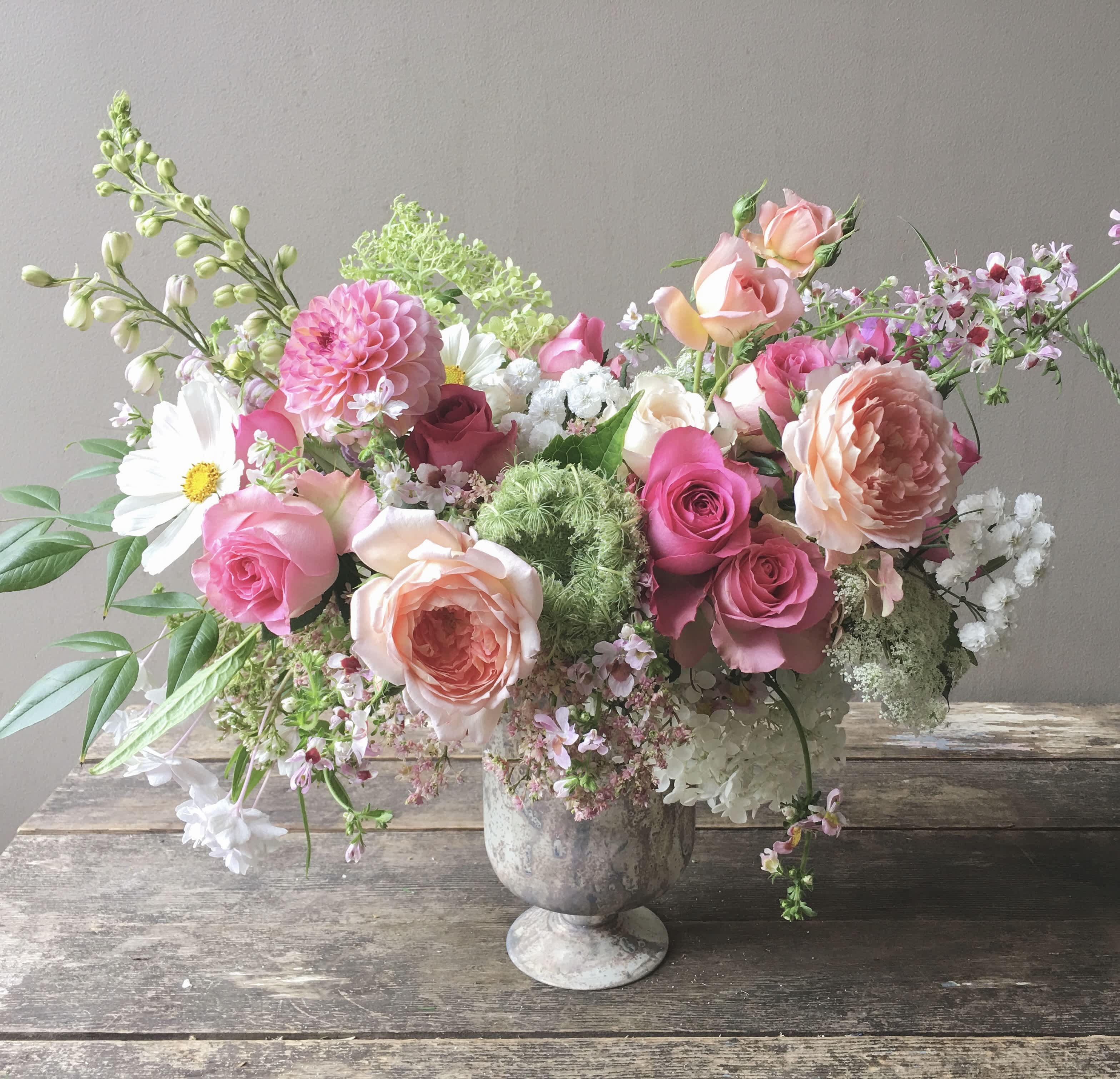 Renée (Gallery Photo) - A gorgeous bouquet in soft romantic colors! Garden roses, dahlias and other seasonal flowers have been lovingly gathered in a garden inspired design. Will truly lift someone's spirit with this nature's gift of beauty!