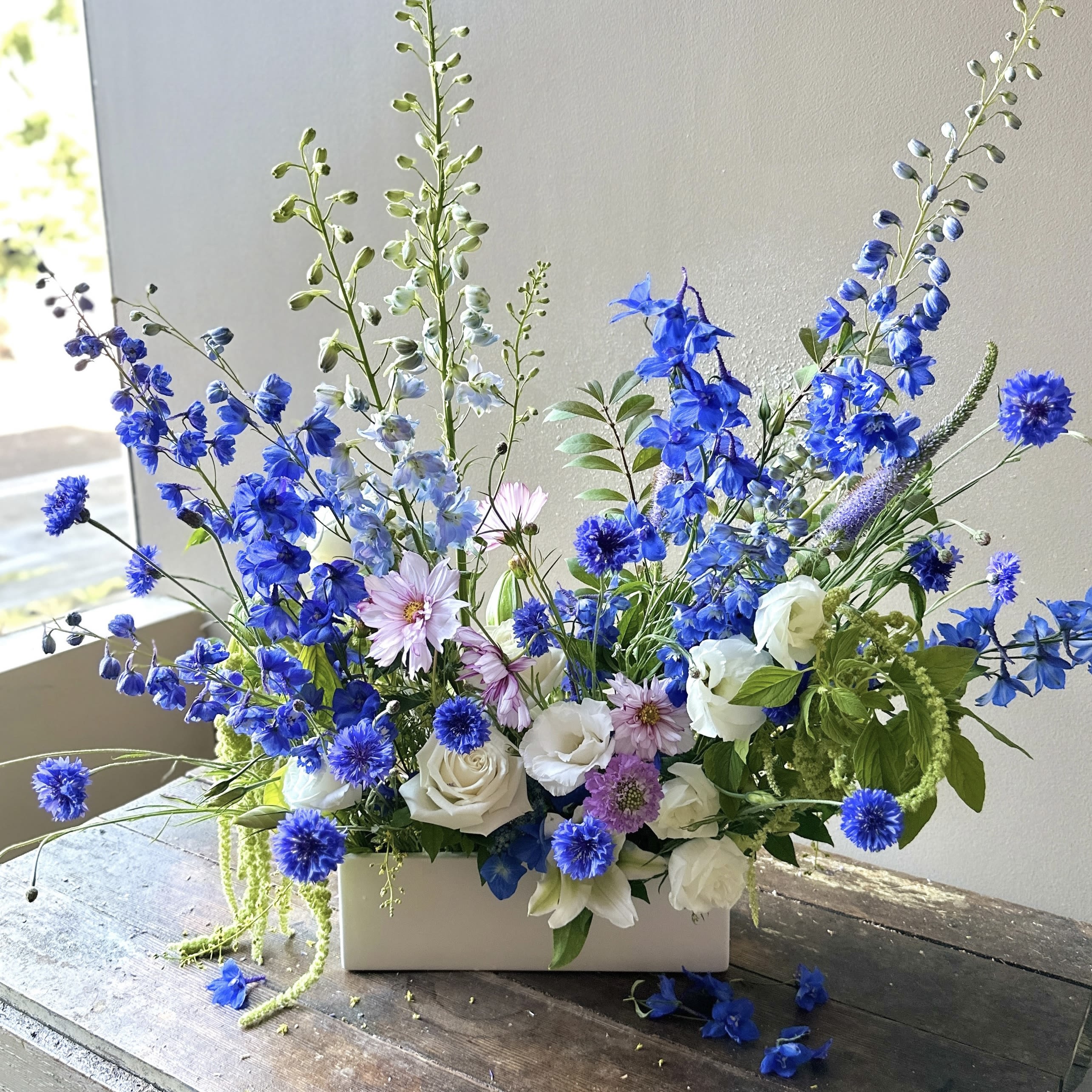 Auden (Gallery Photo) - This naturally vibrant blue bouquet evokes a serene sense of beauty and calm. Artfully arranged with a true garden-inspired touch, it's a stunning expression of nature’s gift!