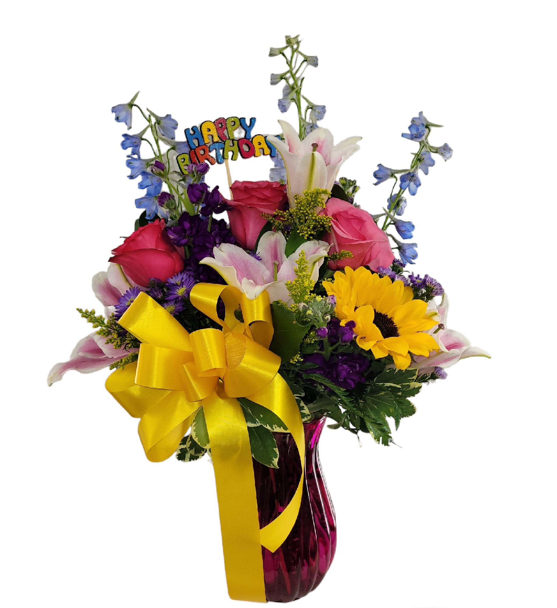 Mixed bouquet with roses, lilies, sunflowers, and a birthday pick in a vase