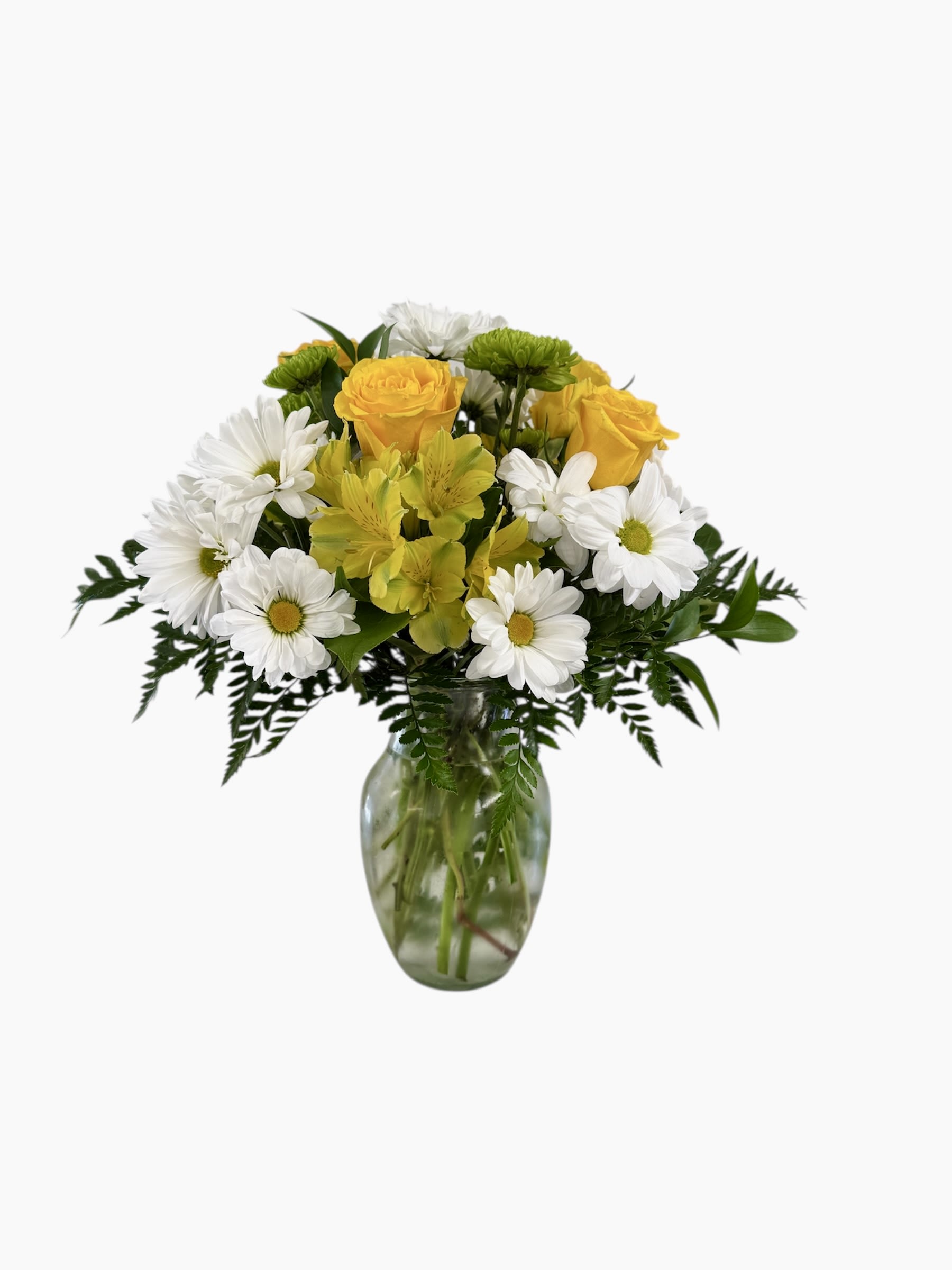 Yellow roses and white daisies in a glass vase
