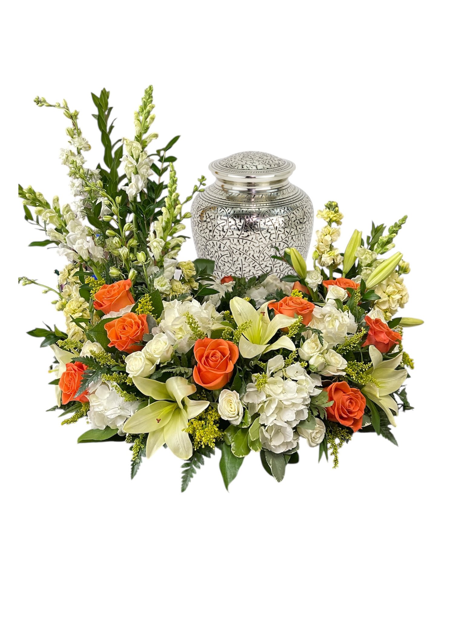 Floral funeral urn arrangement with orange roses and white lilies