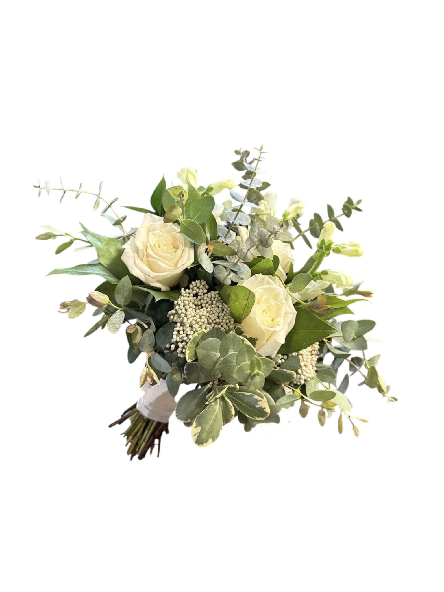 White Garden Style Handtied - A lush handtied bouquet in all white flowers and a variety of greenery. The focal flower is a white rose and the greenery includes eucalyptus, pittosporum and more.
