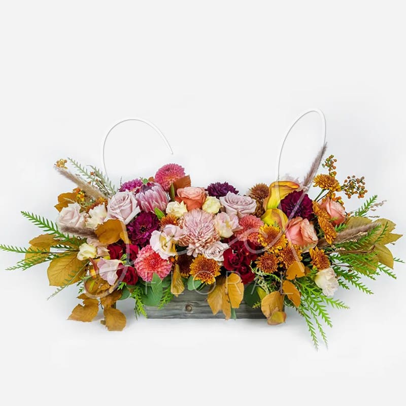 Fall Long &amp; Low  - Our Fall Long &amp; Low arrangement brings all the cozy autumn vibes to your home. Designed in our Woodland Natural Box (12"x4"), this long and low centerpiece features warm seasonal blooms that flow beautifully across the table—perfect for dining or gathering spaces, while staying low enough to enjoy conversation and see your favorite faces across the table. 