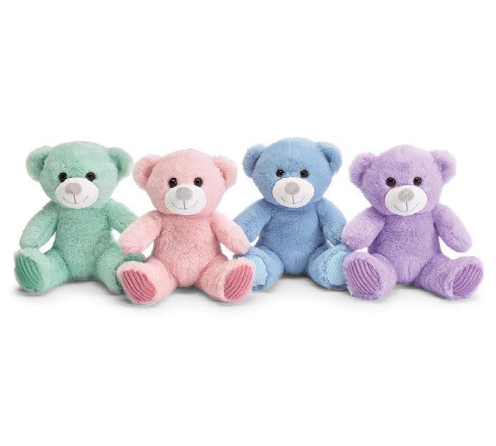 Four pastel teddy bears sitting in a row