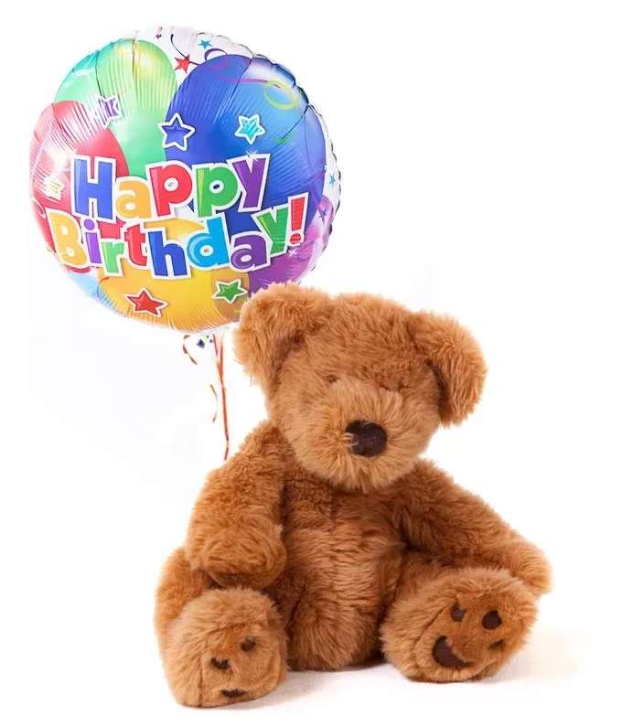 Teddy bear with a colorful Happy Birthday balloon